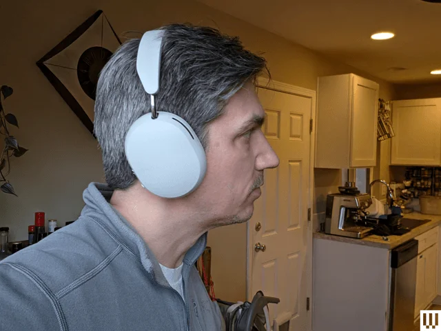 Image may contain: Electronics, Headphones, Adult, Person, Face, and Head